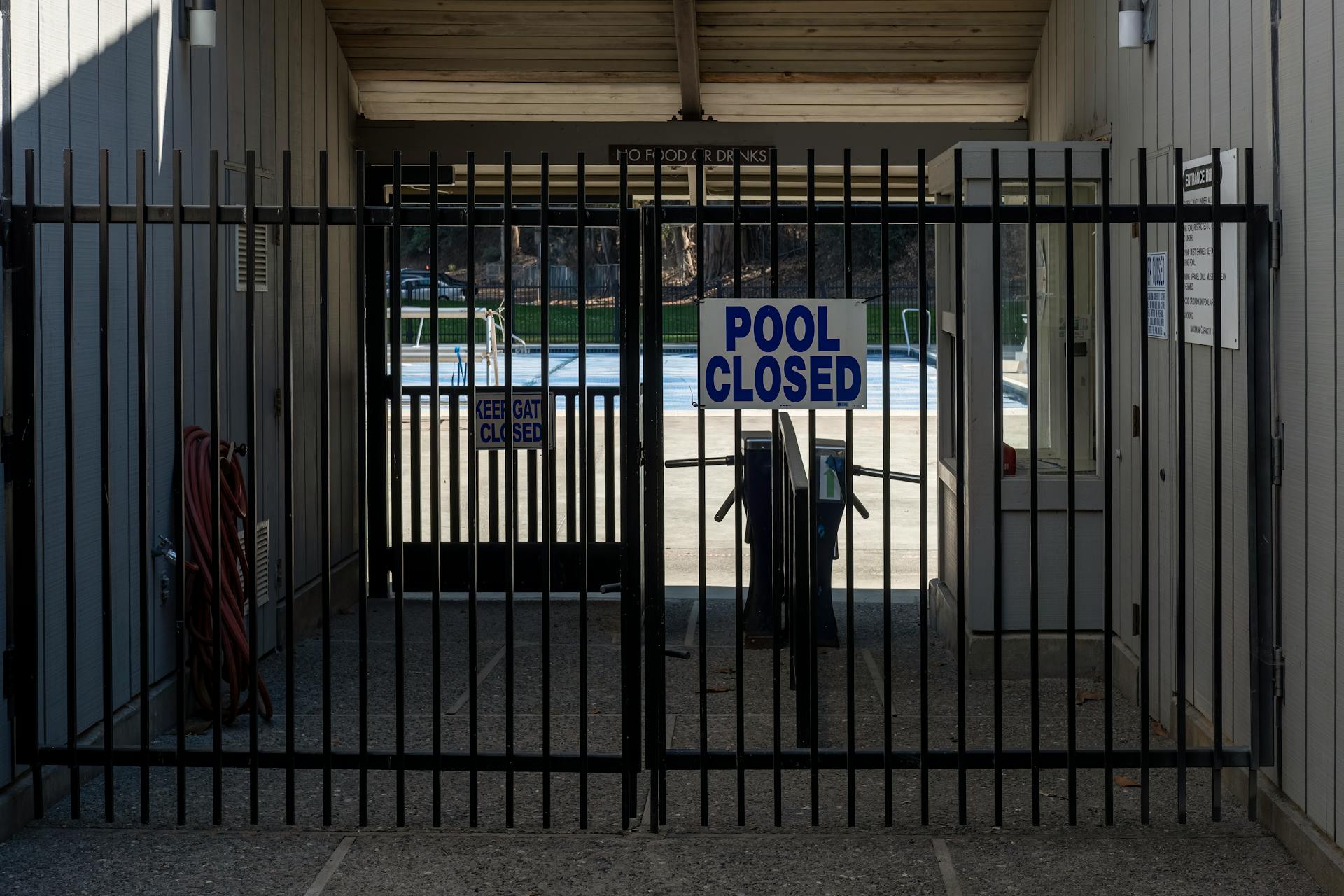 Closed Sign on a Pool Gate