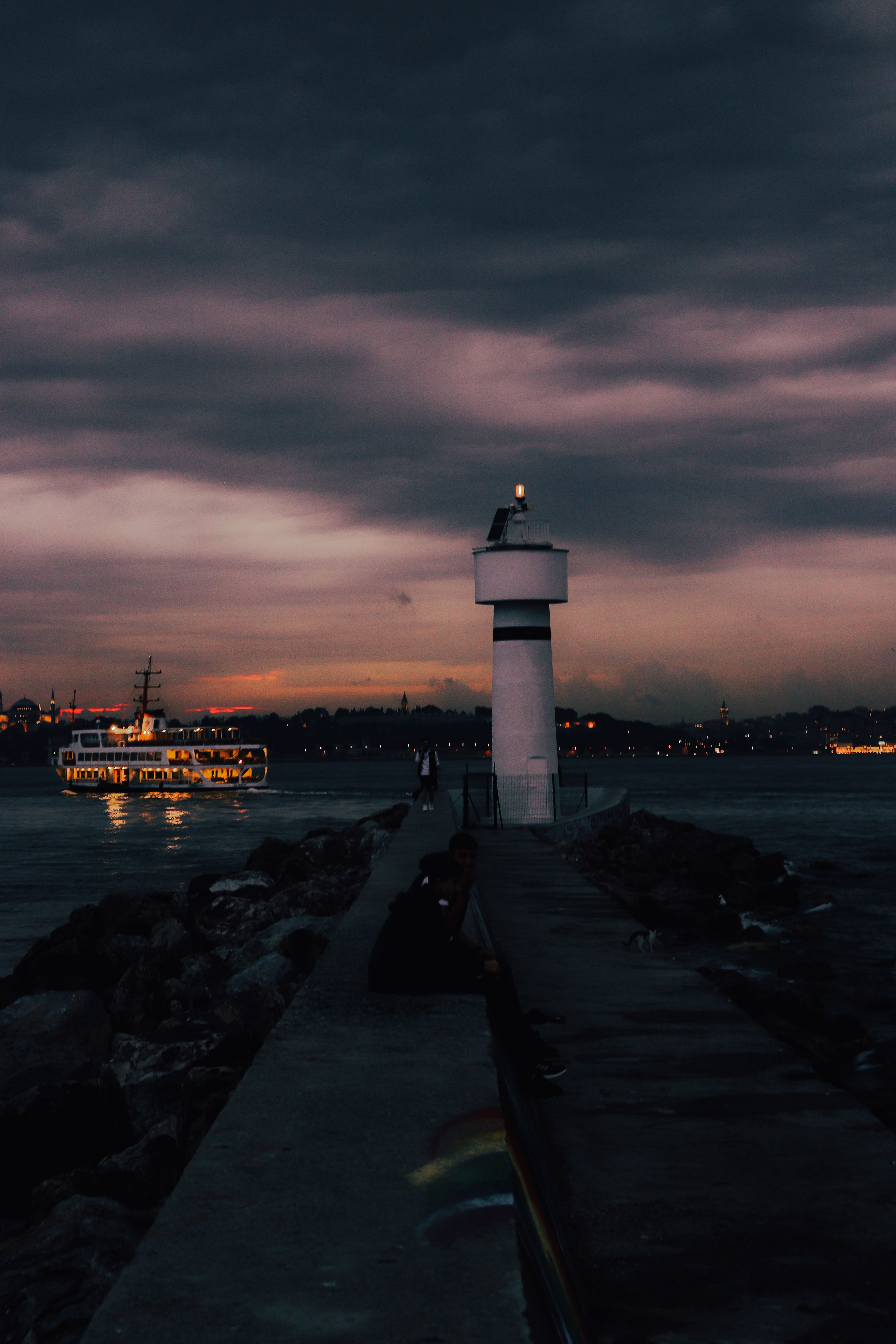 White Lighthouse Near Body of Water during Sunset · Free Stock Photo