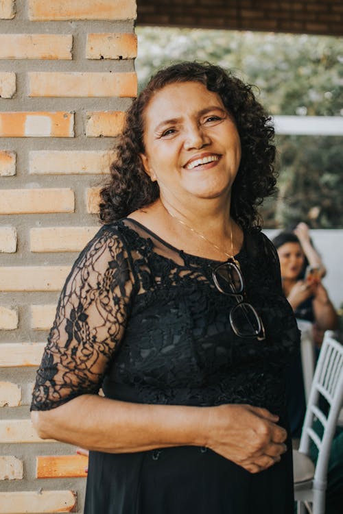 A Woman in a Black Top Smiling