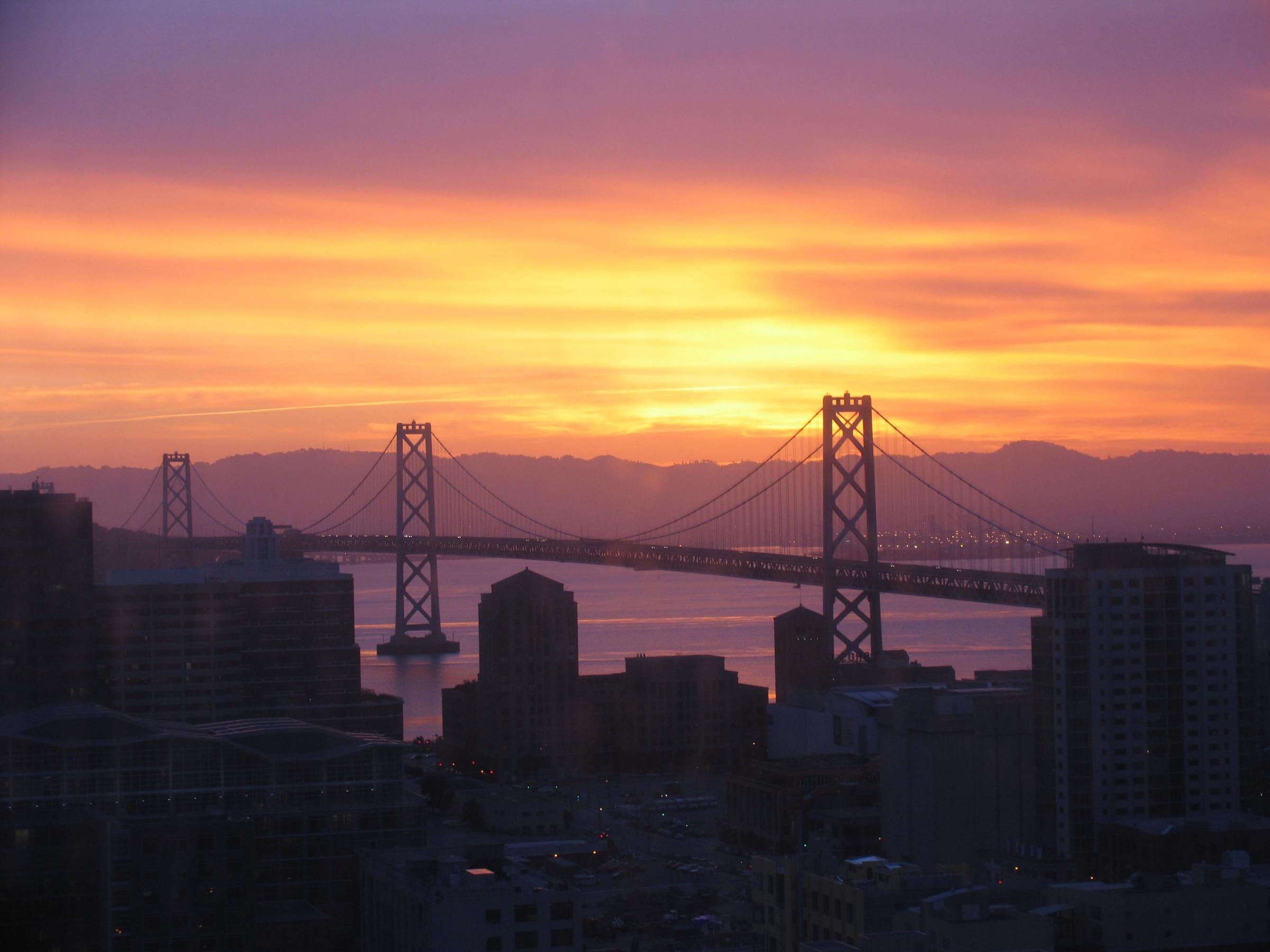 Silhouette of a Suspension Bridge Against the Sky at Sunset · Free ...