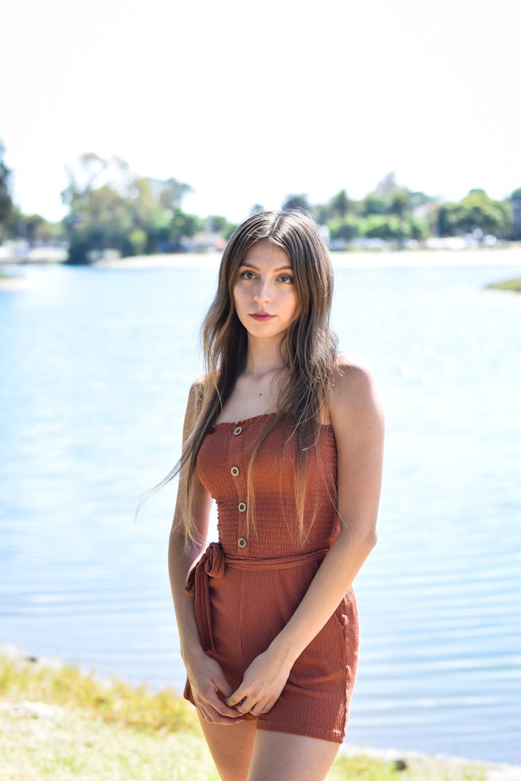 Woman Posing With Water Behind