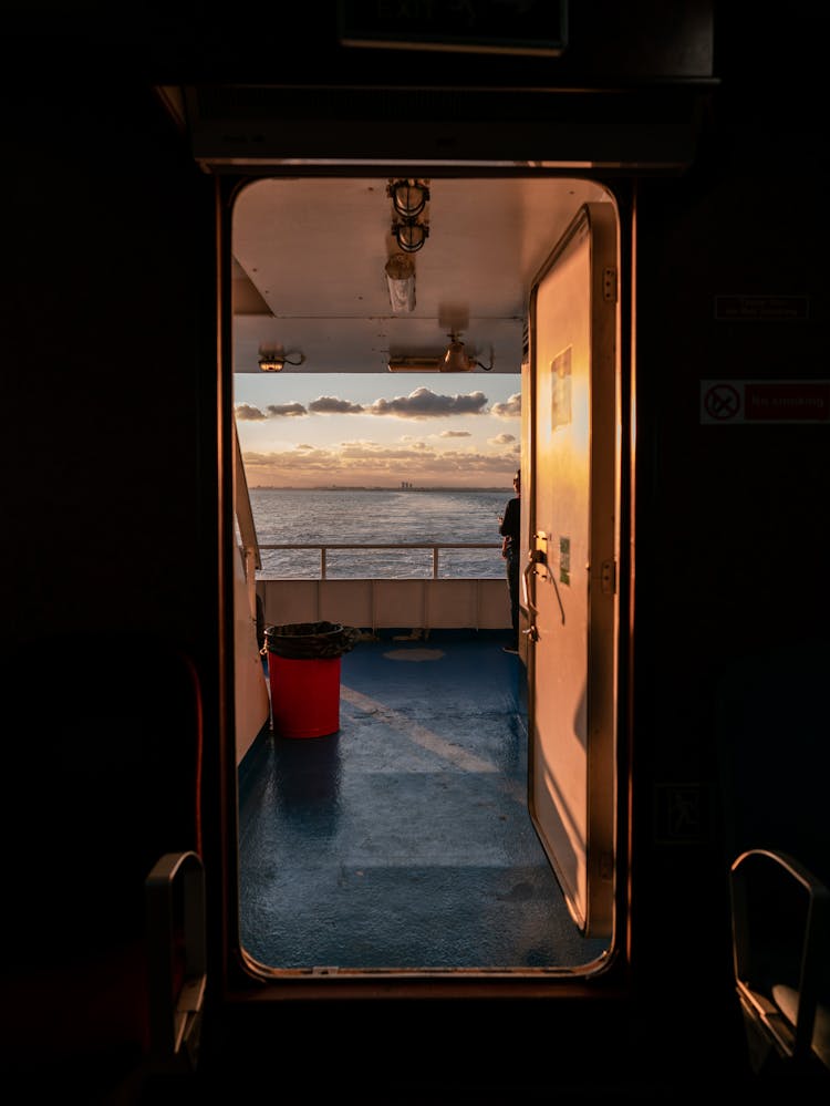 Red And White Boat On Sea