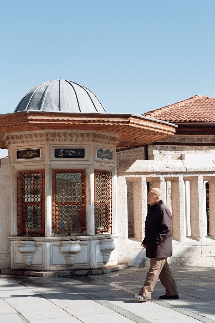 Side View Of An Elderly Man While Walking 