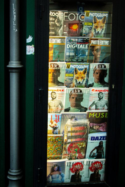 Magazine Display on Clear Window · Free Stock Photo