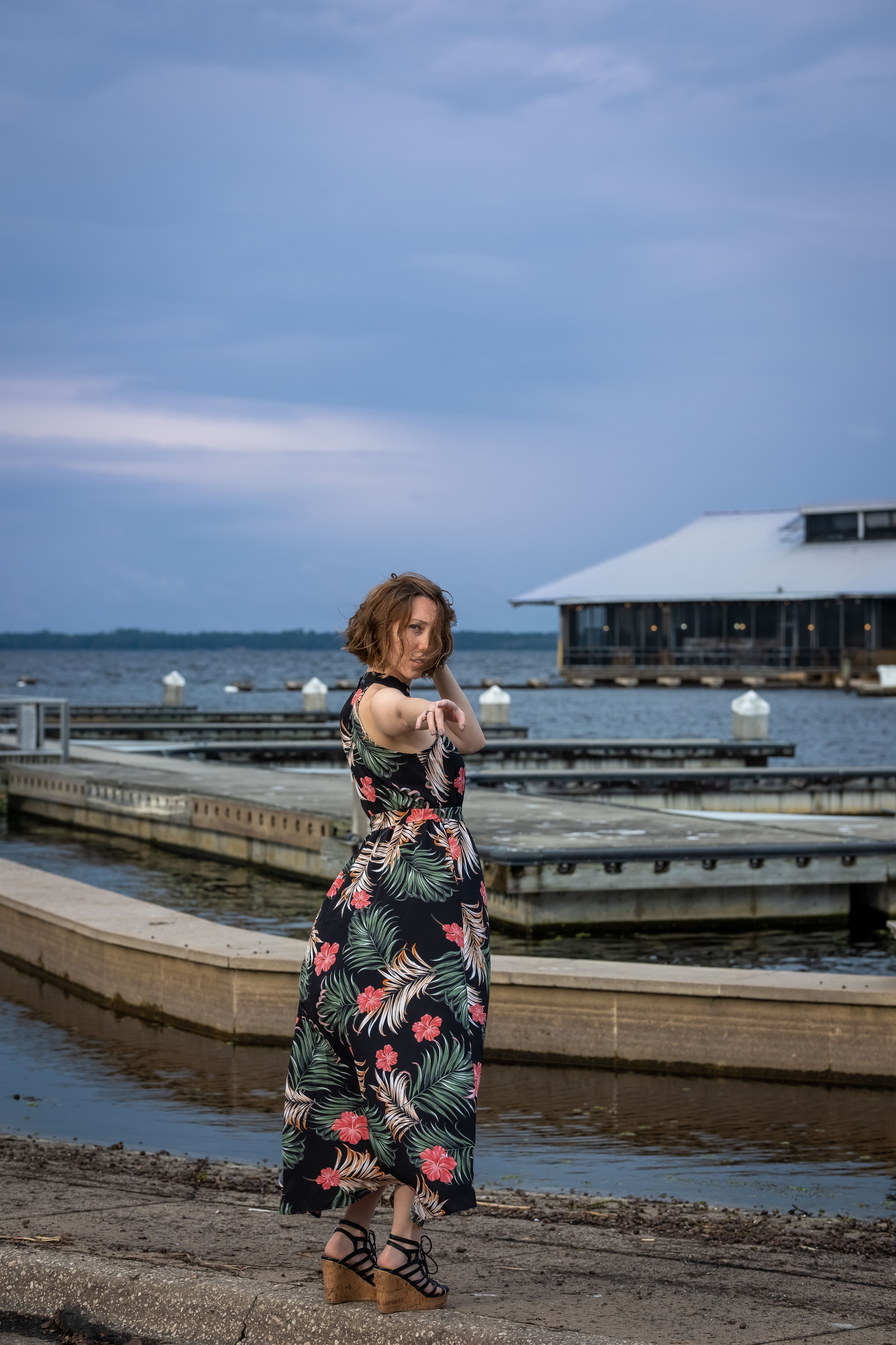 A Woman in Floral Dress Standing Near on the Sea · Free Stock Photo