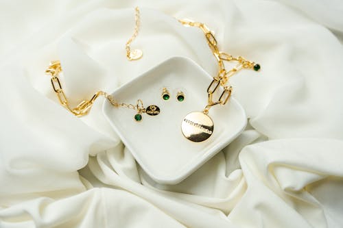 Gold Necklace in a White Ceramic Bowl