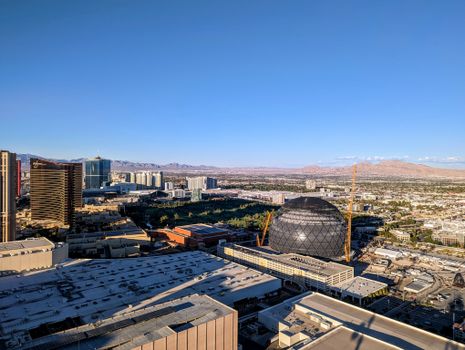 A fan checking the Las Vegas Raiders schedule on a smartphone to confirm Raiders game times.