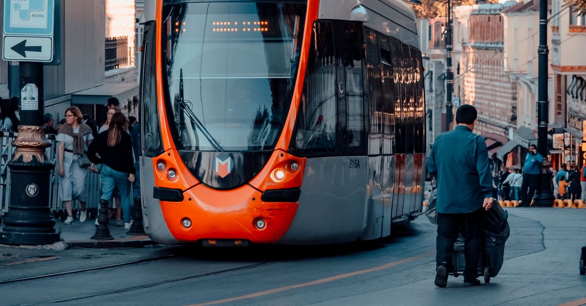 Red and Gray Tram on the Street · Free Stock Photo