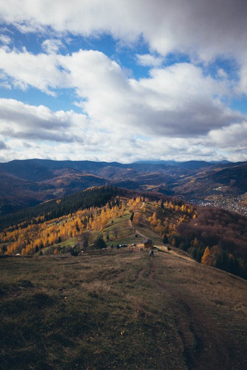 Scenic View of Mountains Under Cloudy Sky