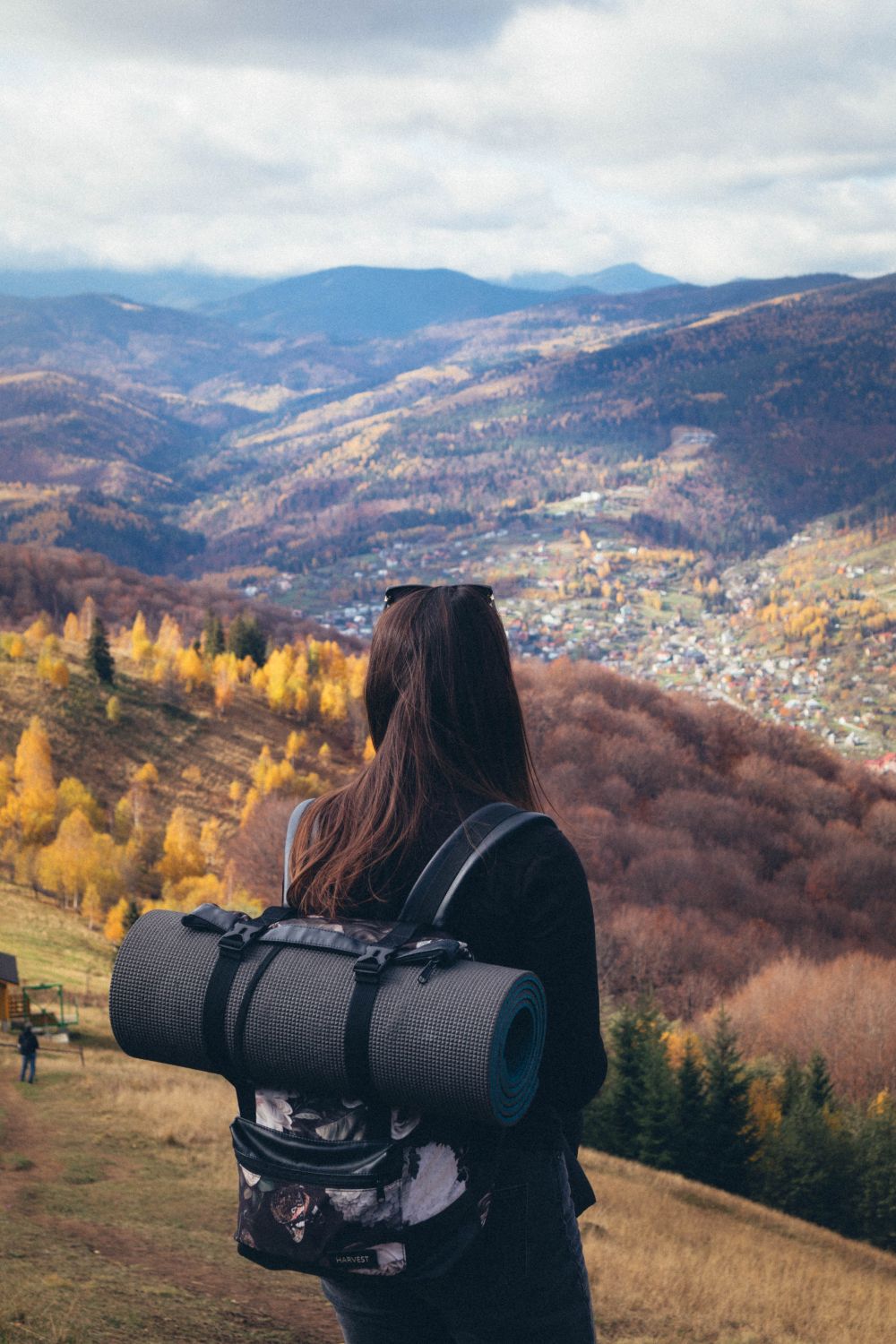 Back View of Woman Hiking on Hills in Autumn · Free Stock Photo