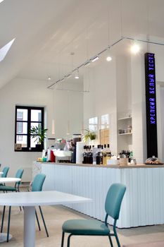 Contemporary coffee shop interior in Grodno, featuring a stylish counter and seating area.