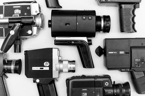 Free Assorted Camera Lot on Surface in Grayscale Photo Stock Photo