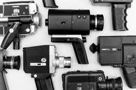 Assorted Camera Lot on Surface in Grayscale Photo
