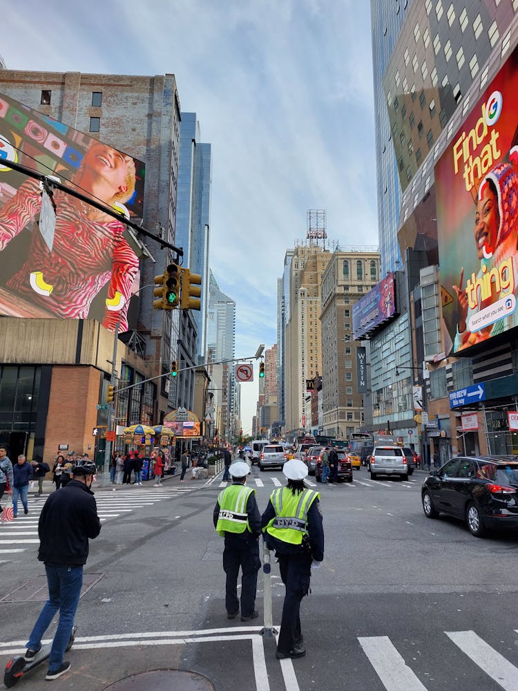 Police Officers On City Street In Downtown