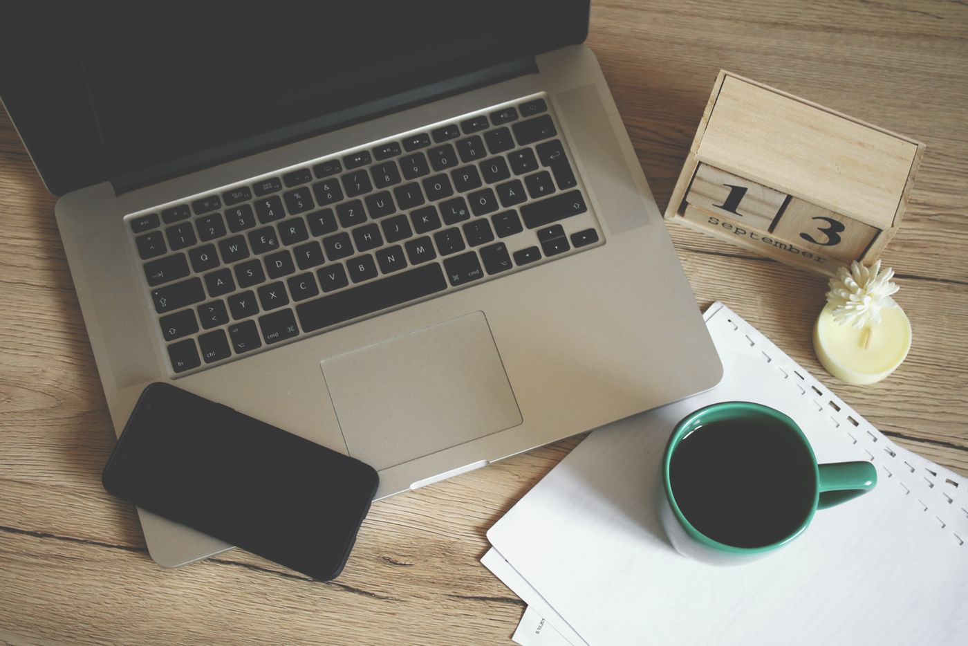 Desk with laptop, notebook and coffee — photo by Aleksandar Cvetanovic on Pexels