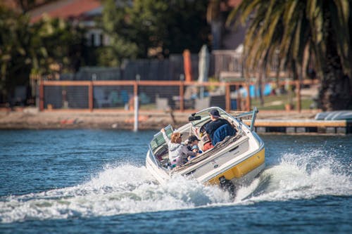 Yellow and White Boat on Water