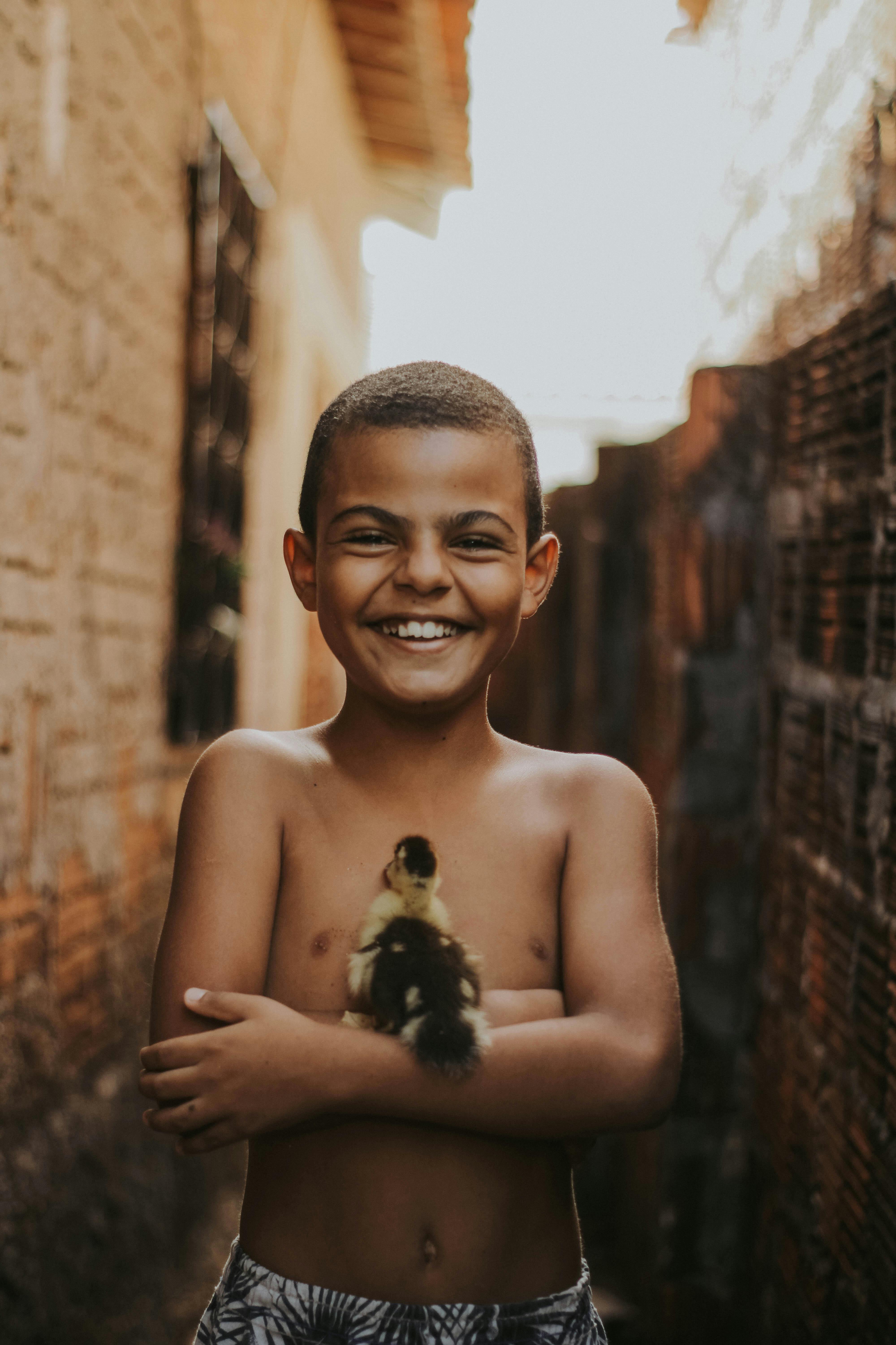 Happy Boy with Little Bird · Free Stock Photo