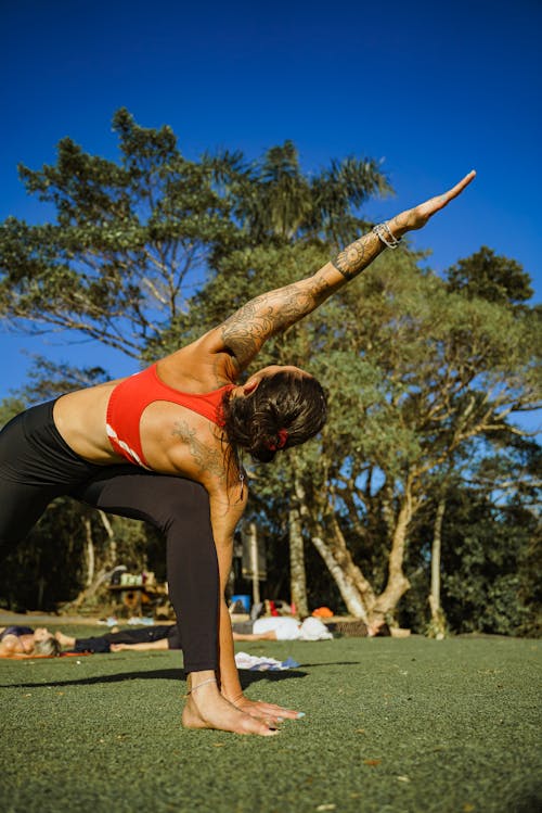 Woman in Sports Bra and Black Leggings Doing Yoga
