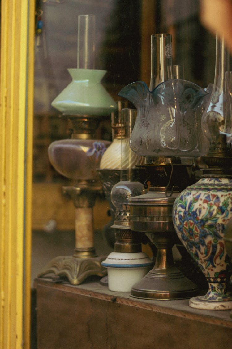 Vintage Gas And Oil Lamps In Store Window