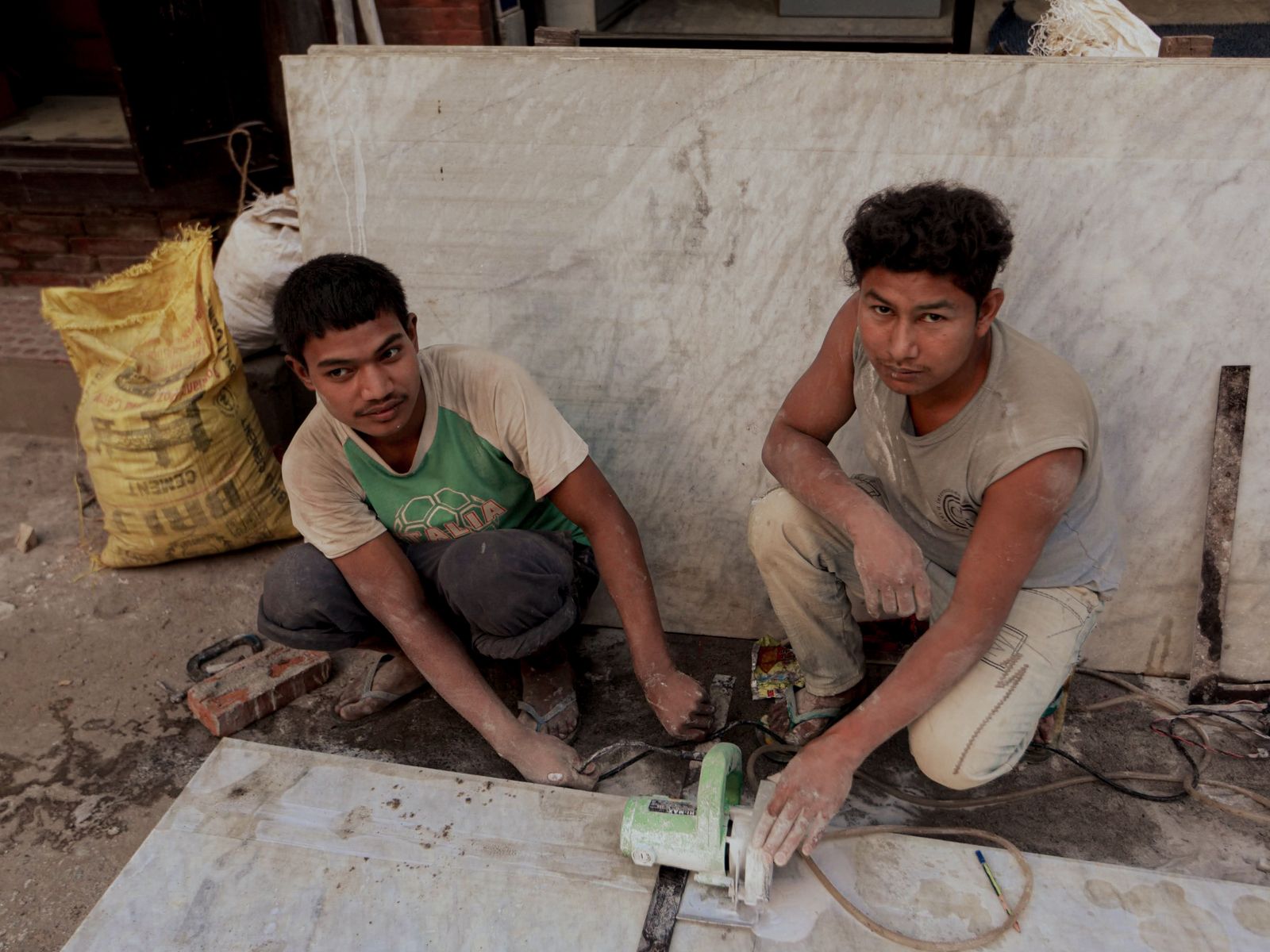Craftspeople cutting and preparing natural stone