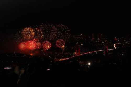 Free Spectacular fireworks light up the night sky above the Bosphorus Bridge in Istanbul, creating a dazzling cityscape. Stock Photo