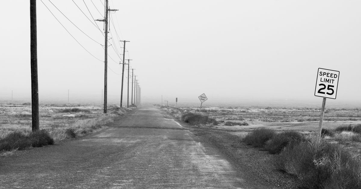 Monochrome Photography of an Empty Road With Speed Limit Sign · Free ...