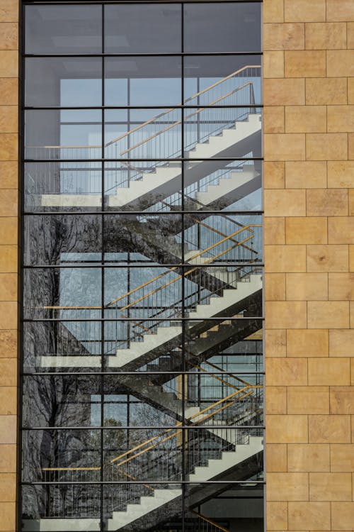 Staircase behind a Glass Exterior of a Modern Building 