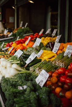 Colorful assortment of fresh vegetables displayed at a market stall, perfect for healthy lifestyle concepts.