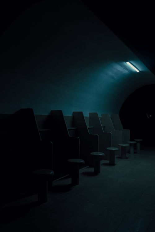 Free Dimly lit underground tunnel in Istanbul with empty seats creating a moody atmosphere. Stock Photo