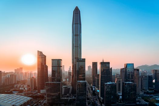 Vibrant Shenzhen skyline with tallest buildings at sunset, showcasing urban development.
