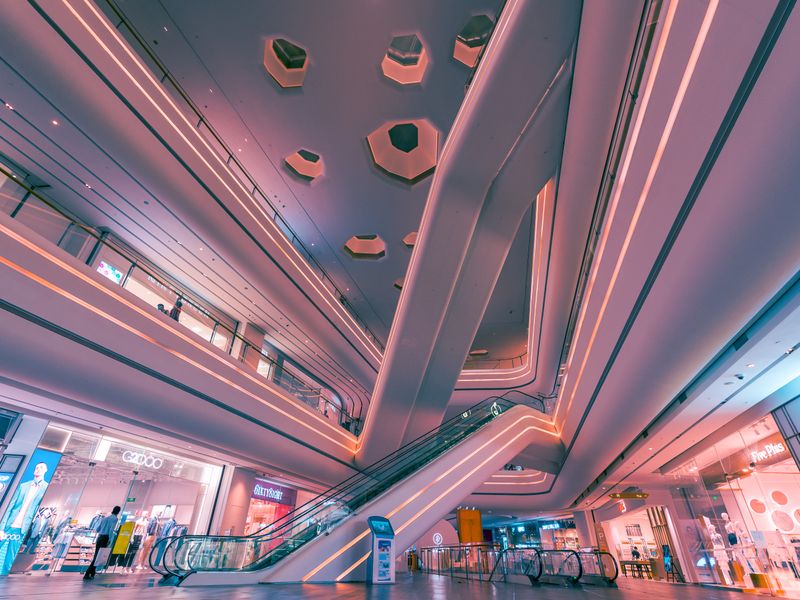 Interior of a modern shopping mall with bright lighting