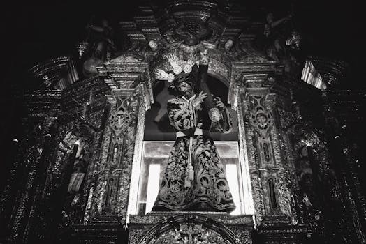 Gothic style religious sculpture inside a historic Sevillian church, emphasizing devotion and artistry.