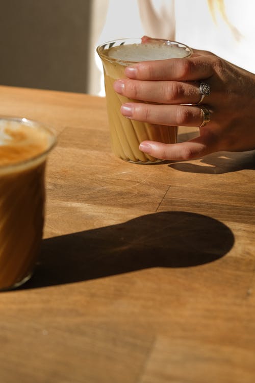 Person Holding a Cup of Coffee