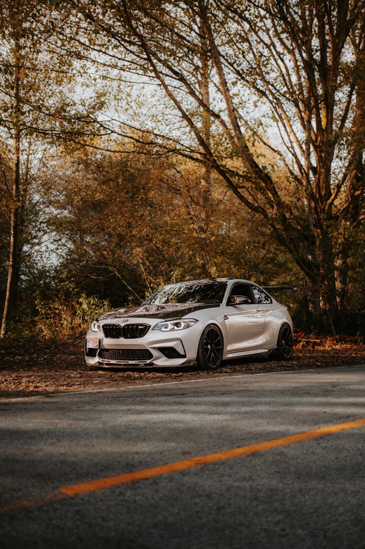 White Coupe Car On The Roadside