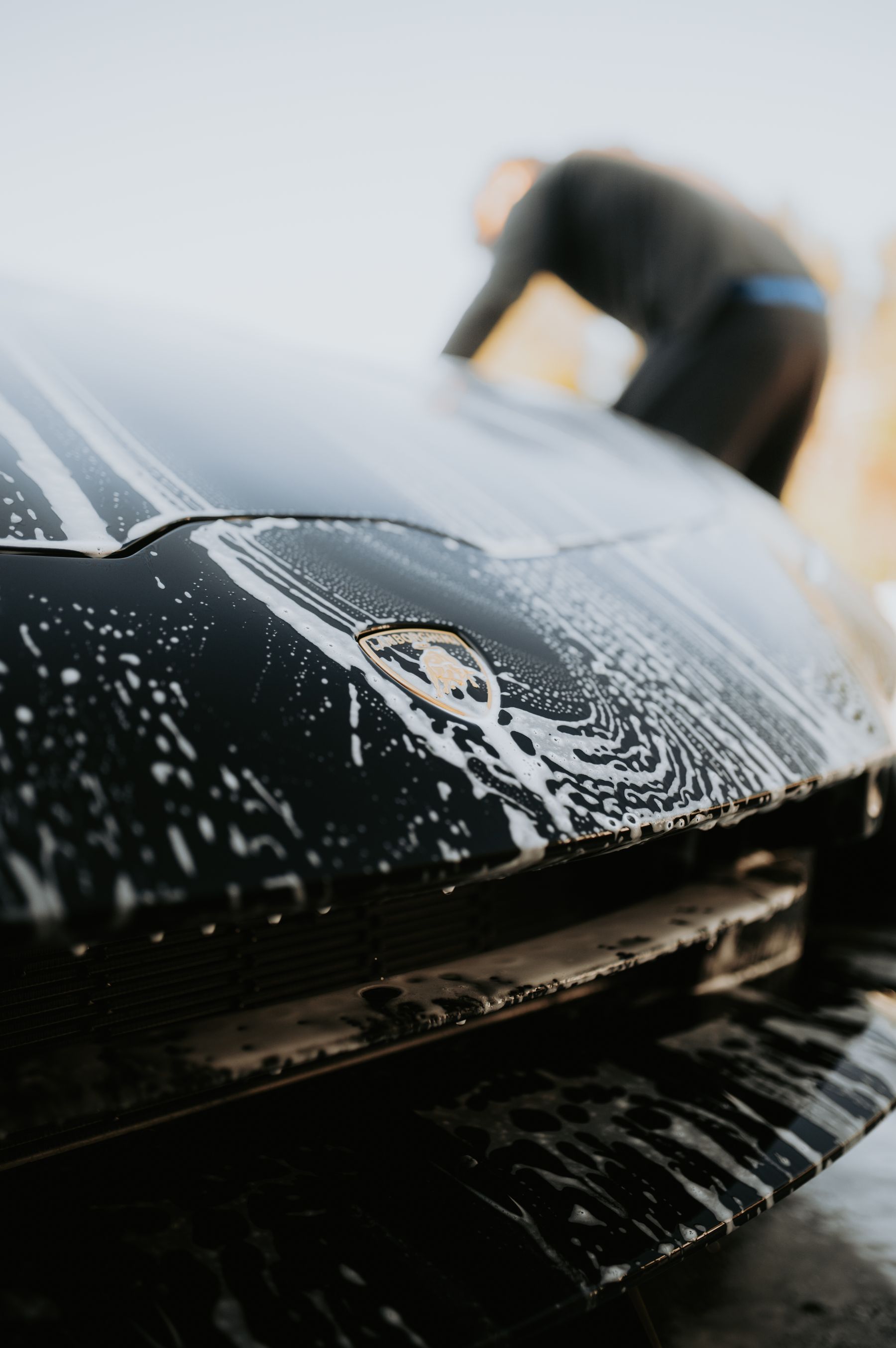 Foam on a luxury vehicle during a premium wash