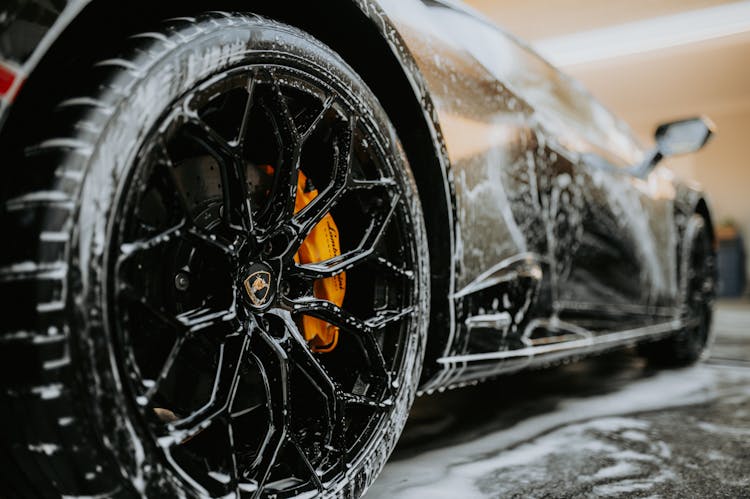 Close-up Shot Of A Car Wheel During Car Wash