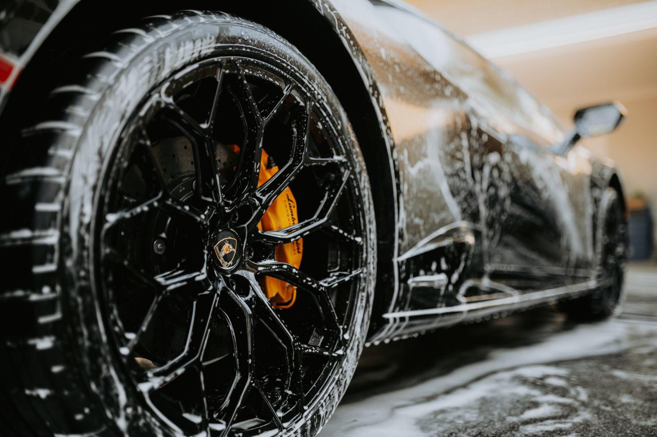 Luxury wheel covered in wash foam