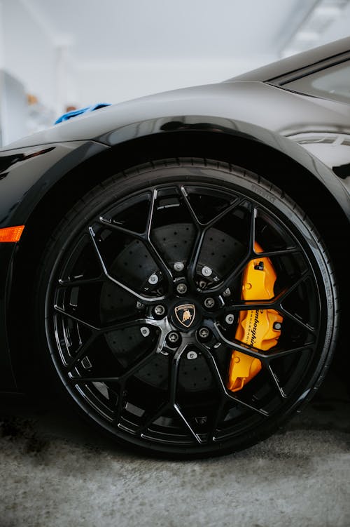 Close-up Shot of a Black Car's Wheel