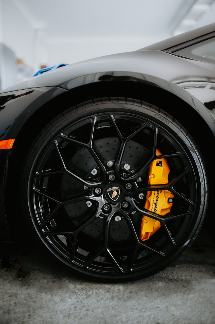 Close-up Shot Of A Black Car's Wheel