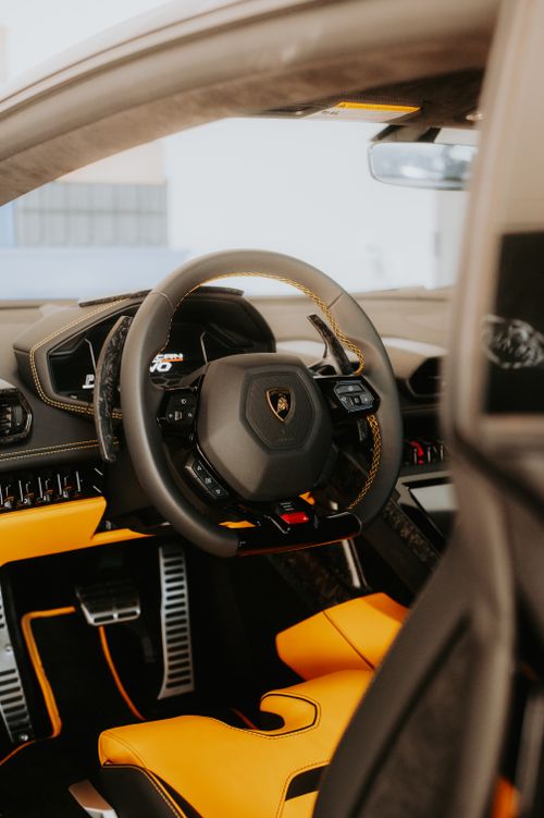 Free Close-up view of a luxury sports car interior featuring sleek design and premium materials. Stock Photo