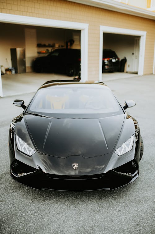Black Lamborghini Parked on the Driveway