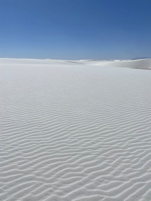 Wavy Surface of Sand Under Blue Sky