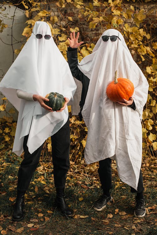 2 Person Holding Halloween Pumpkins