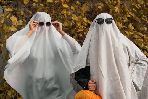 2 Person Wearing Black Sunglasses