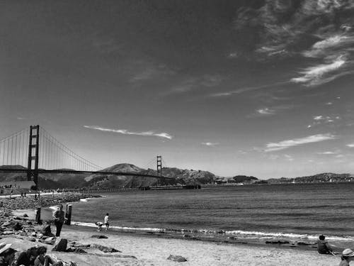 Grayscale Photo of Suspension Bridge