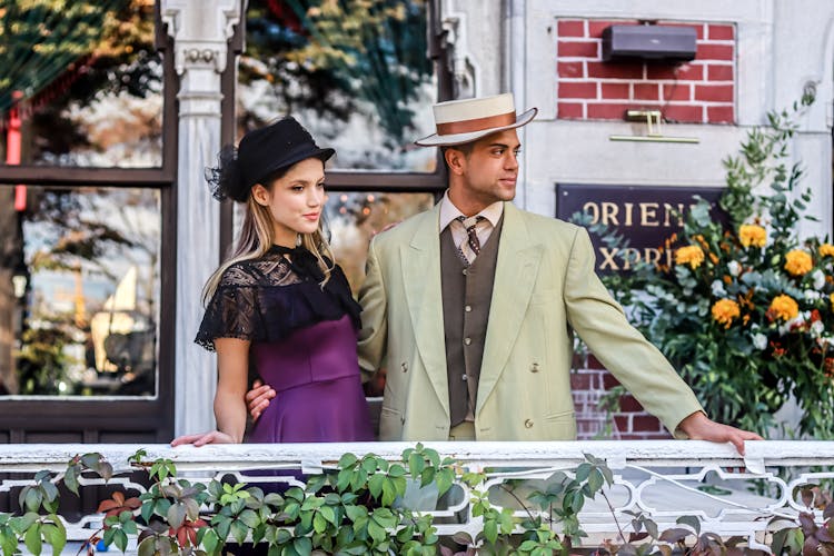 Couple In Retro Clothes Posing On Balcony