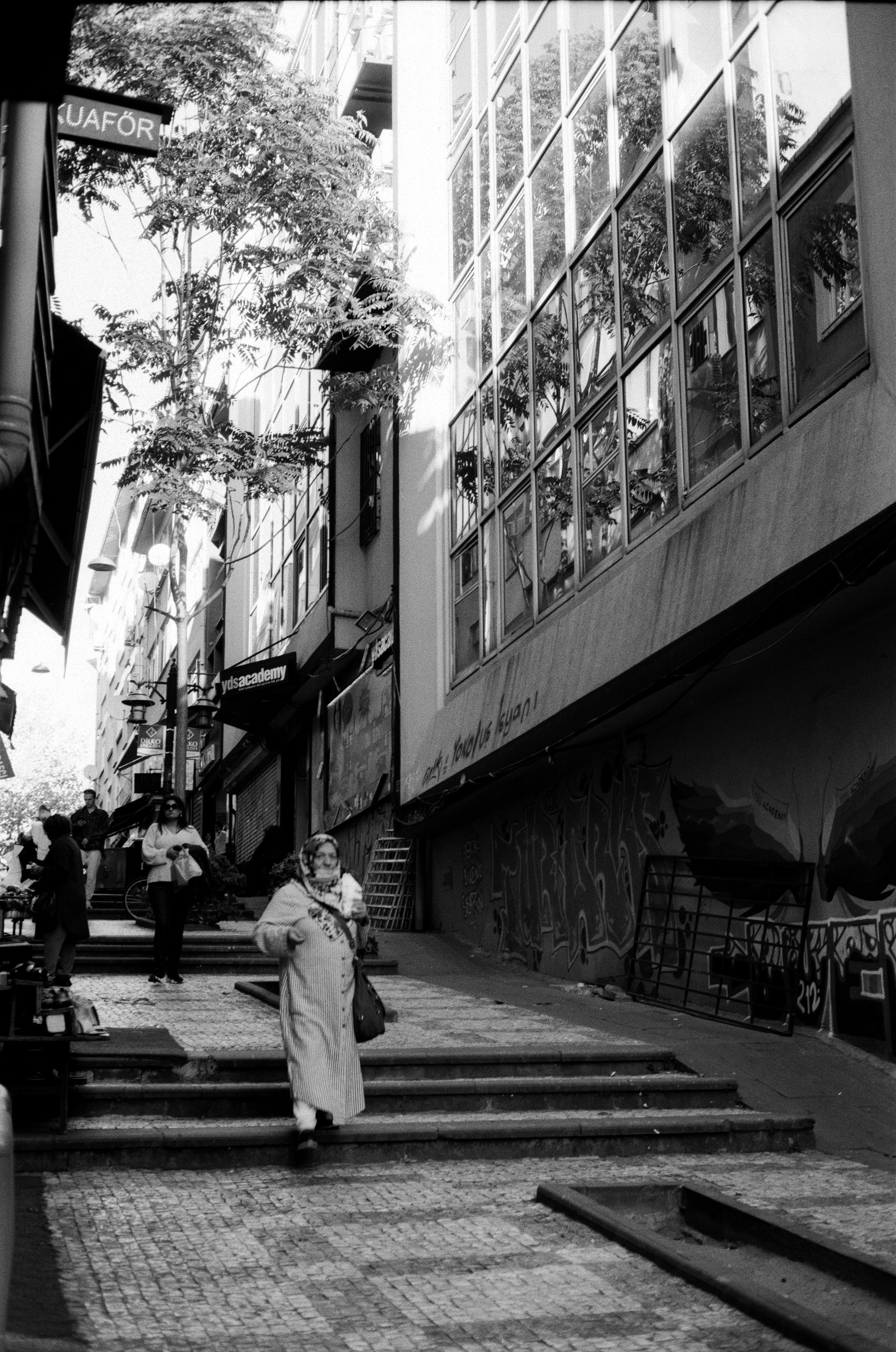 Grayscale Photography of a Person Walking on the Street · Free Stock Photo