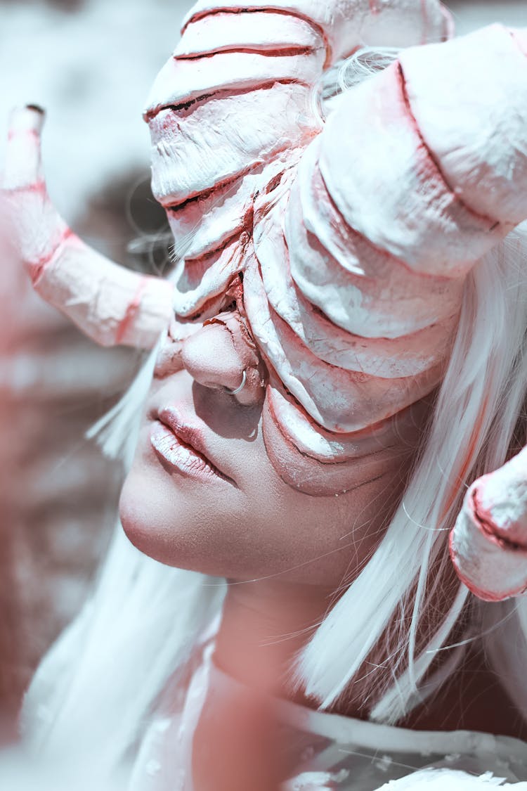 Close-up Of Woman With Horns Mask