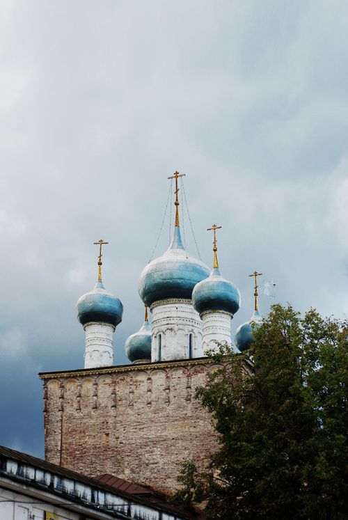 Free Stunning view of a traditional Russian Orthodox church with blue domes against a cloudy sky. Stock Photo