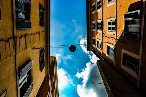 Brown Concrete Houses Under Blue Sky